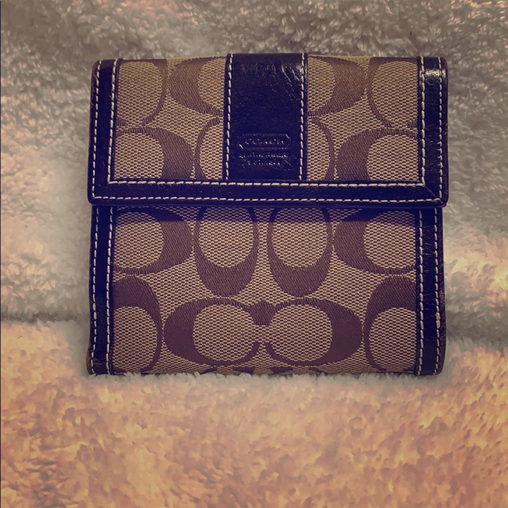 Brown and tan Coach bifold wallet